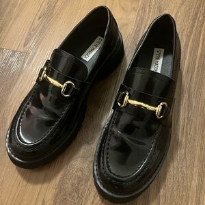 Steve Madden Glossy Black Loafers with Gold Buckle